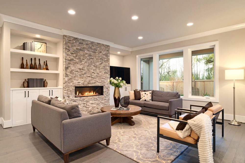 Luxury large natural modern and rustic living room interior with brown sofas.